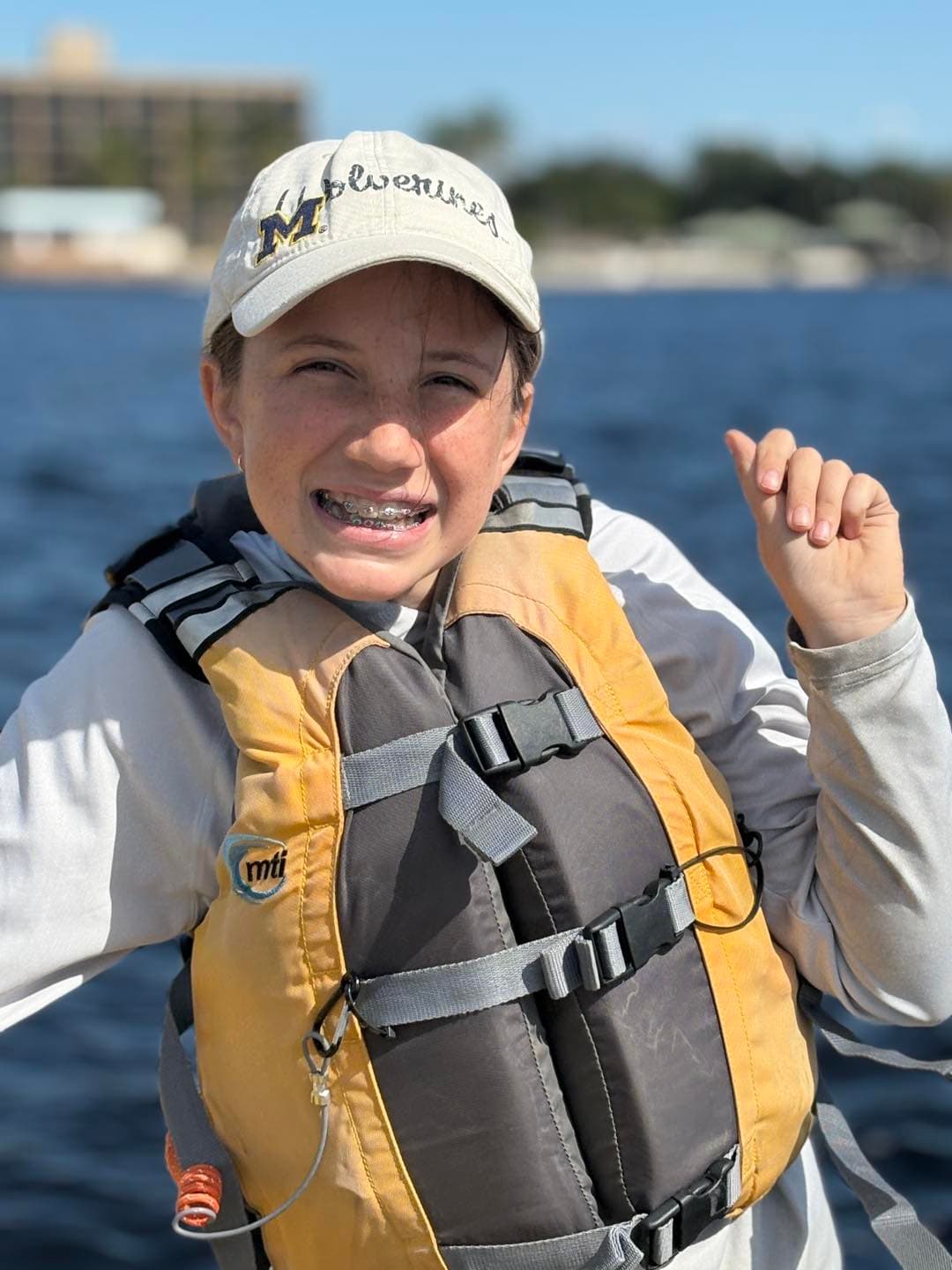 Boy in life jacket on the water