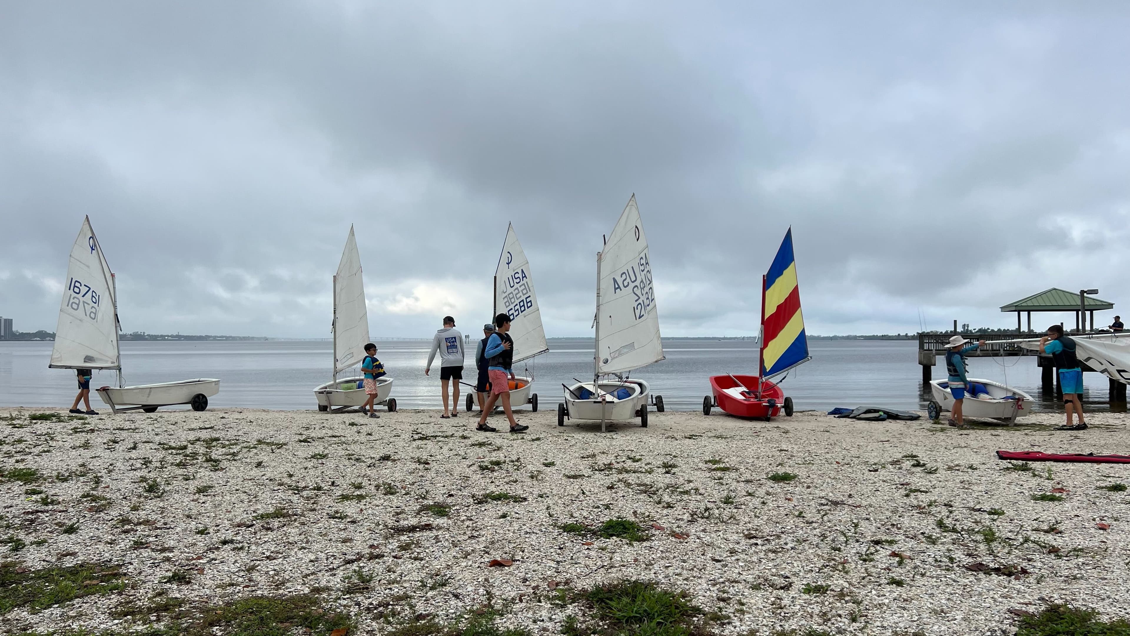 Sailing fleet lined up on the beach at Edison Sailing Center