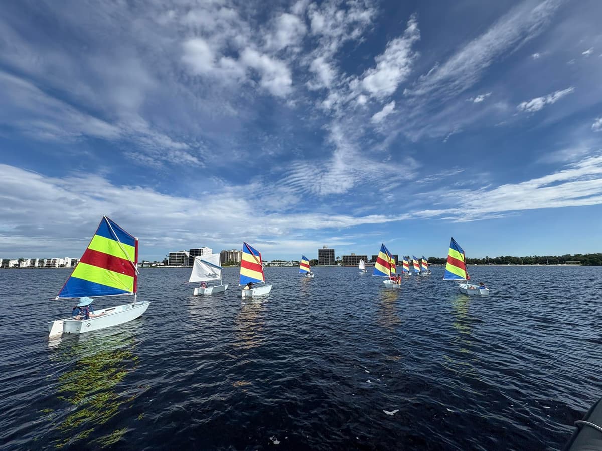 Fleet of sailboats with colorful sails on the Caloosahatchee River