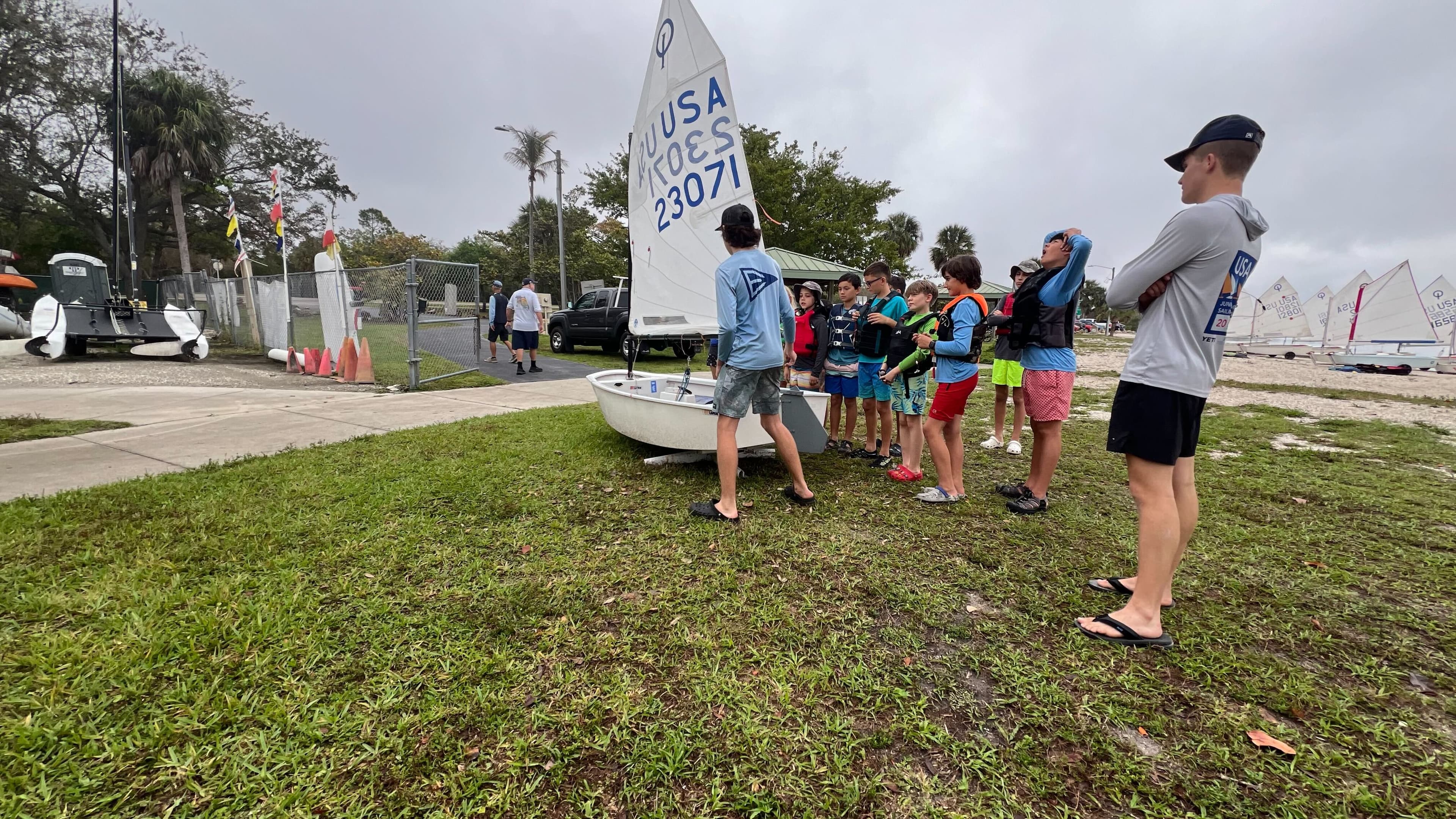 Instructor leading a group sailing lesson