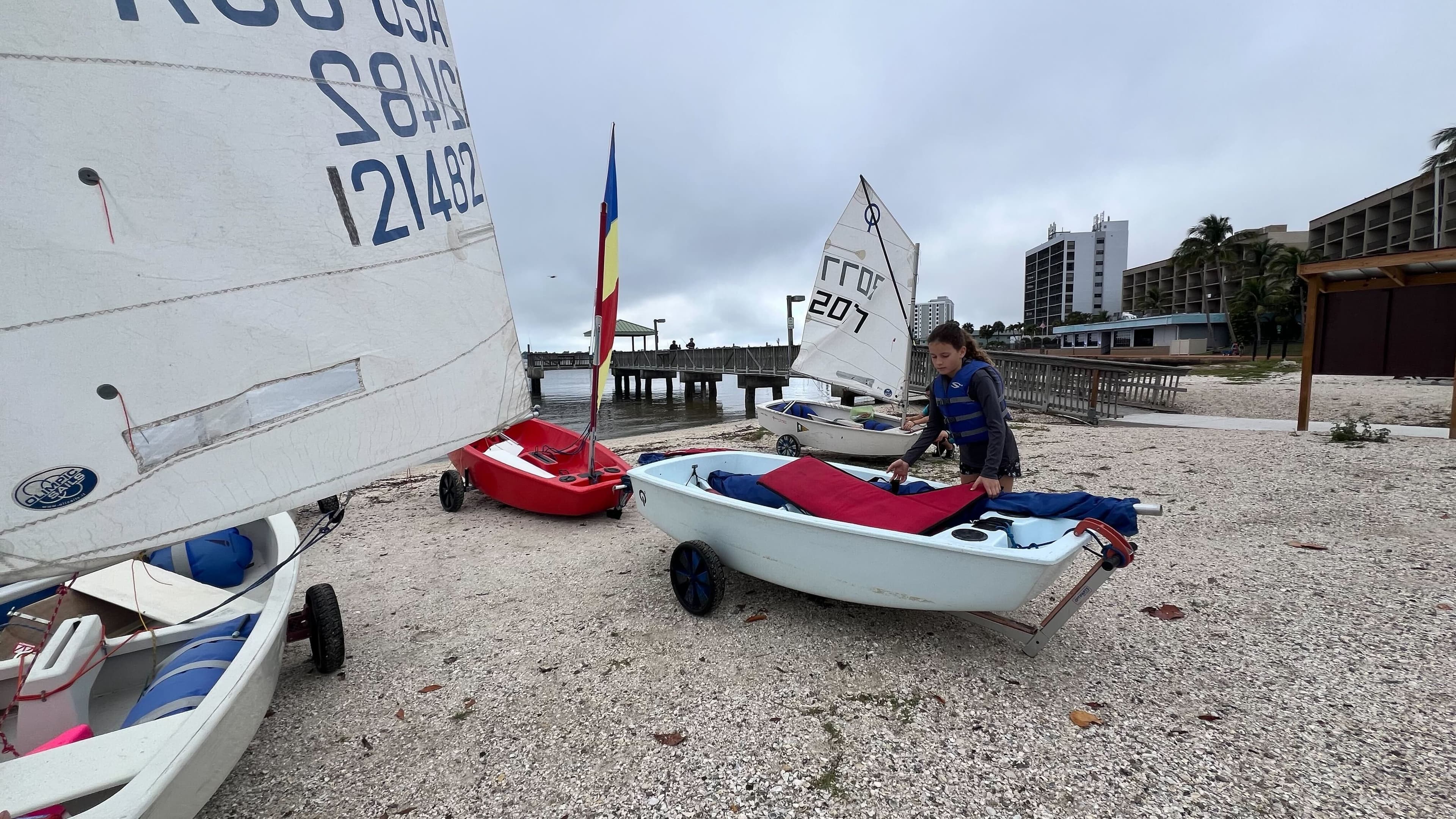 Youth preparing boat near the dock
